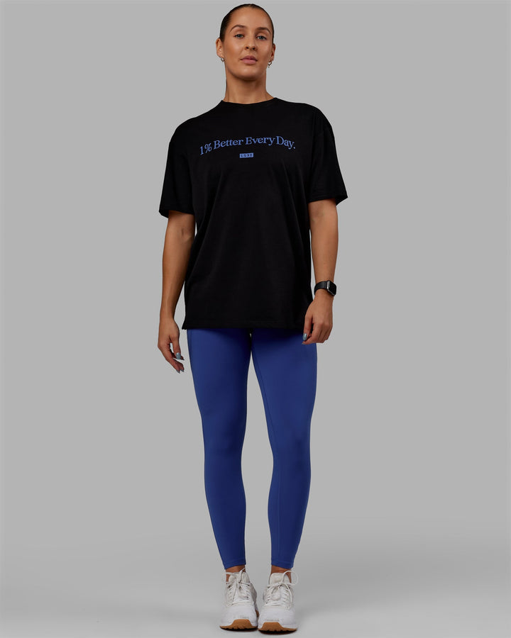 Woman wearing Unisex 1% Better FLXCotton Tee Oversize - Black-Power Cobalt
