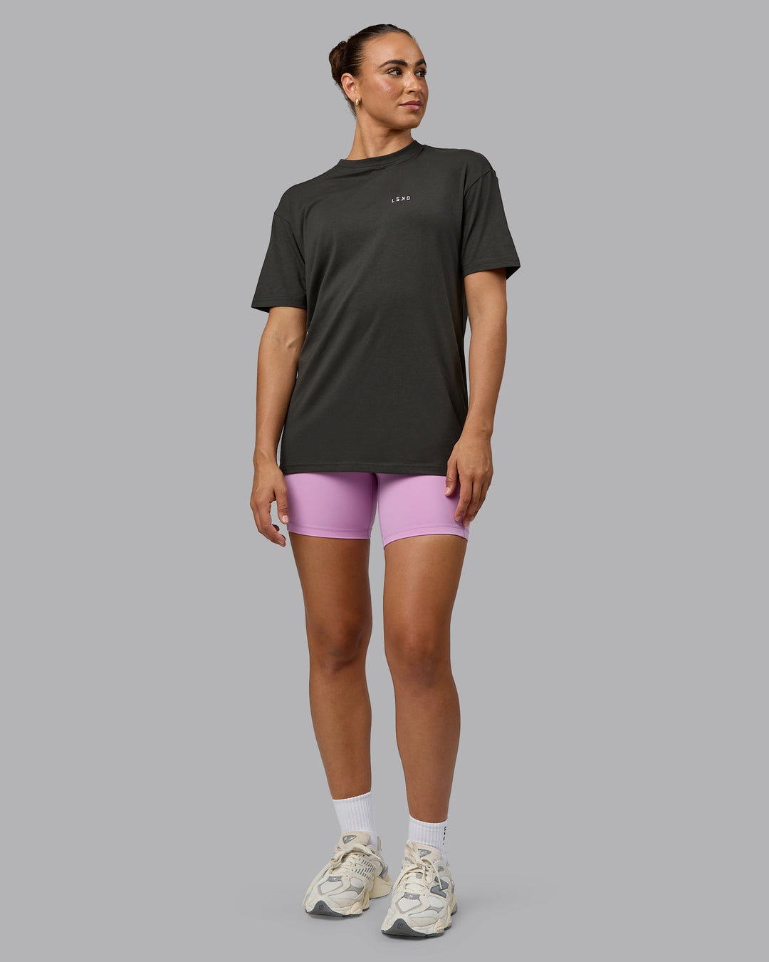 Woman wearing Unisex 1% Better Value Series FLXCotton Tee Oversize - Pirate Black-Light Violet