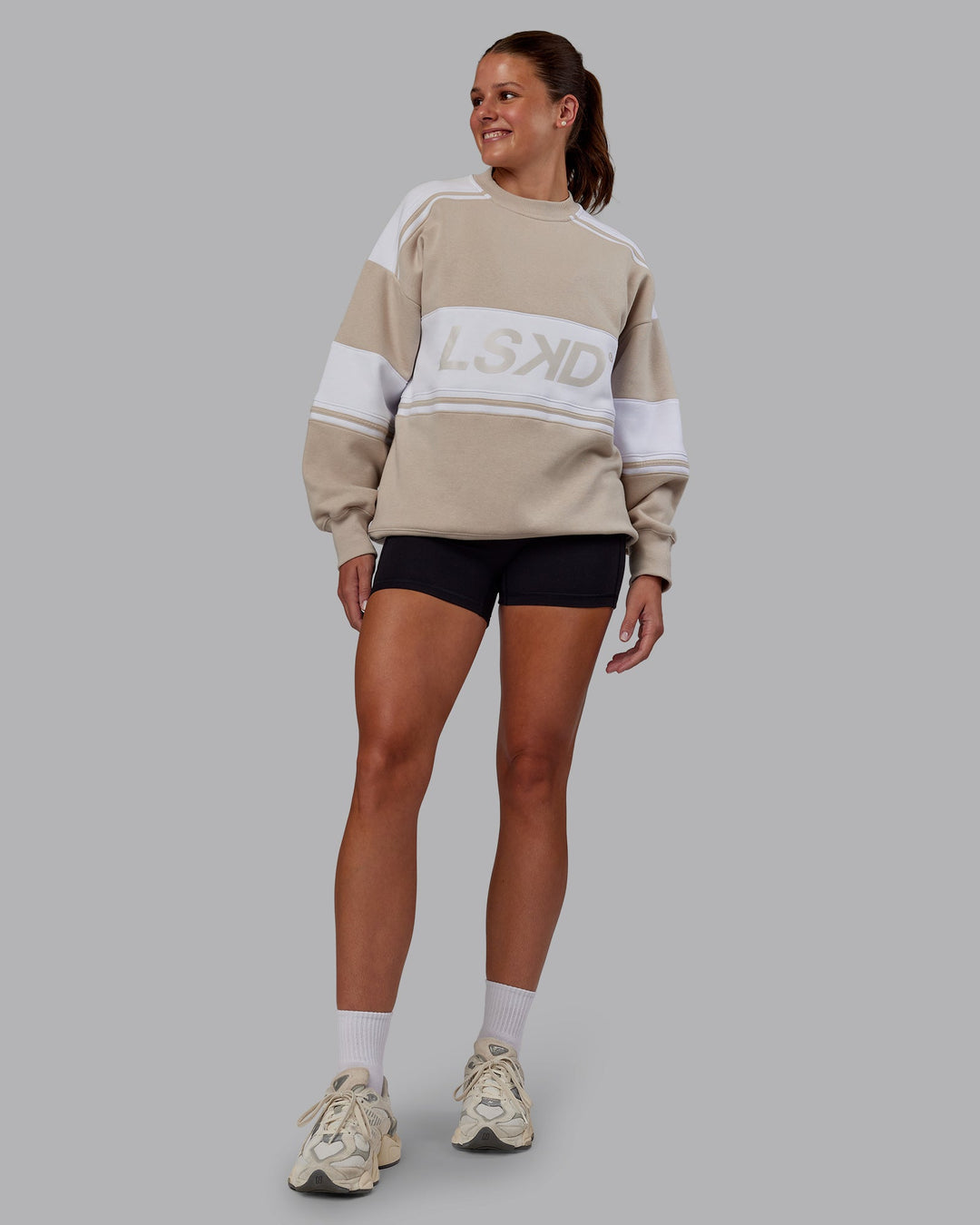 Woman wearing A-Team Sweater Oversize - Shale Beige-White | Model:Phoebe | Size:XS