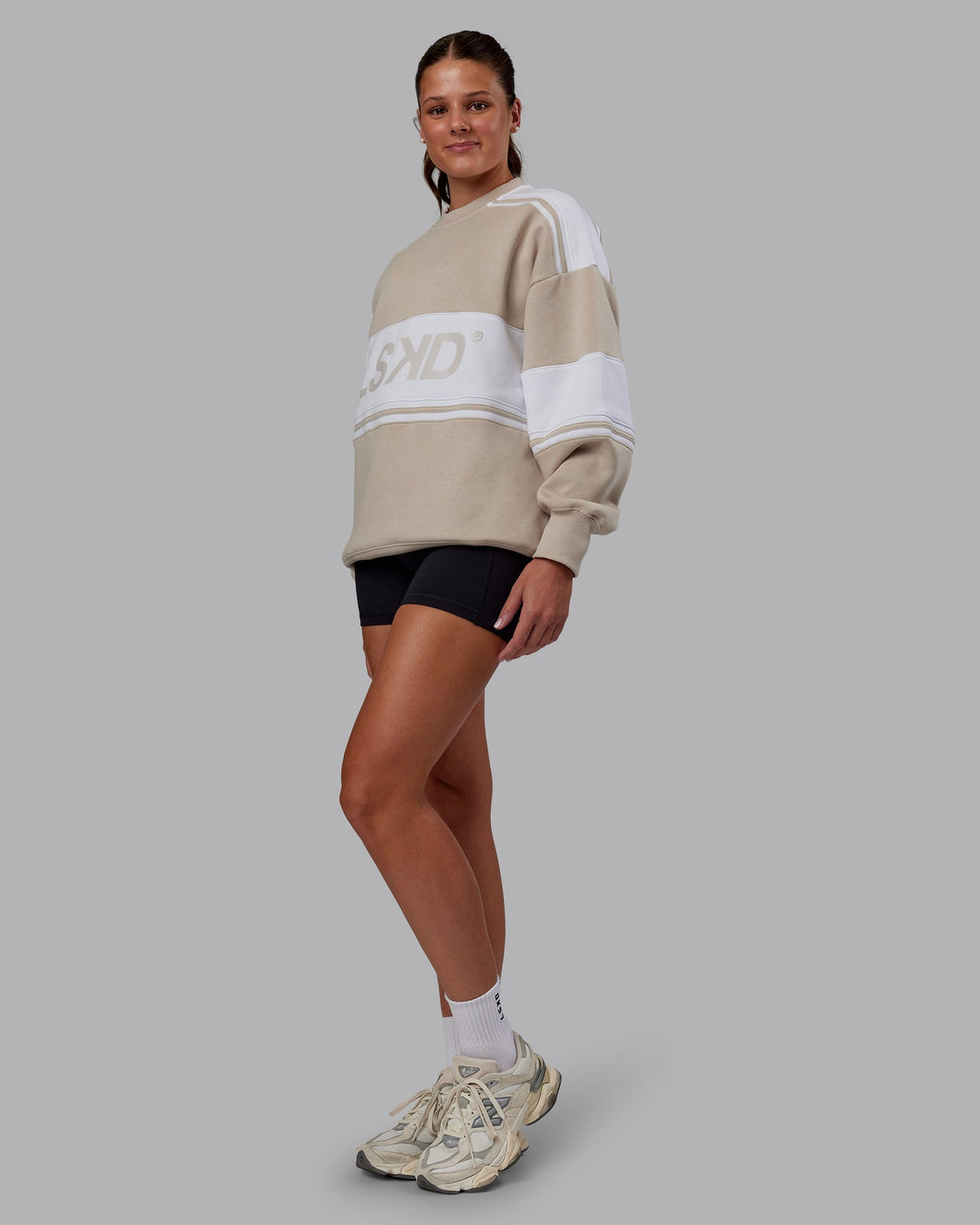 Woman wearing A-Team Sweater Oversize - Shale Beige-White | Model:Phoebe | Size:XS