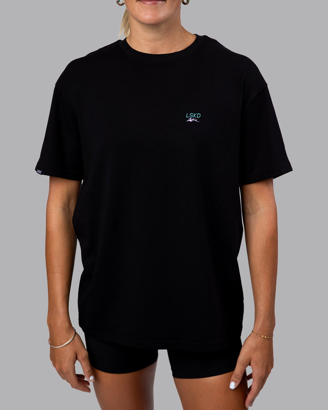 Woman wearing Digital World Tee FLXCotton Oversize in Black | Size:XS