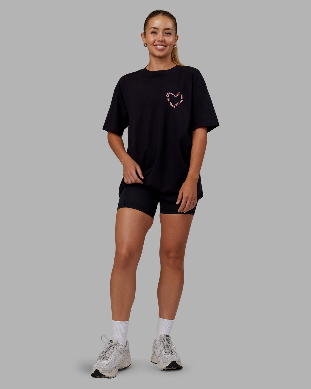 Woman wearing Love The Process FLXCotton Oversize Tee - Black-Pink Lemonade | Model:Hannah | Size:XS