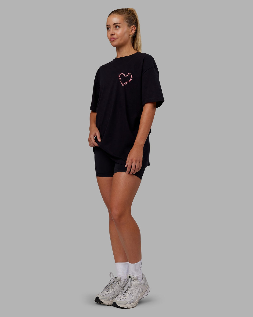 Woman wearing Love The Process FLXCotton Oversize Tee - Black-Pink Lemonade | Model:Hannah | Size:XS