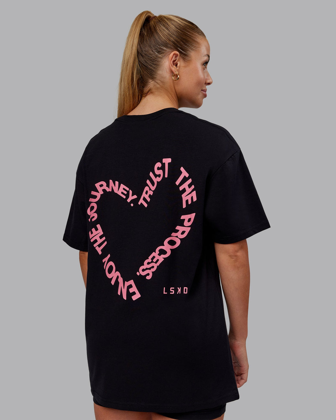 Woman wearing Love The Process FLXCotton Oversize Tee - Black-Pink Lemonade | Model:Hannah | Size:XS