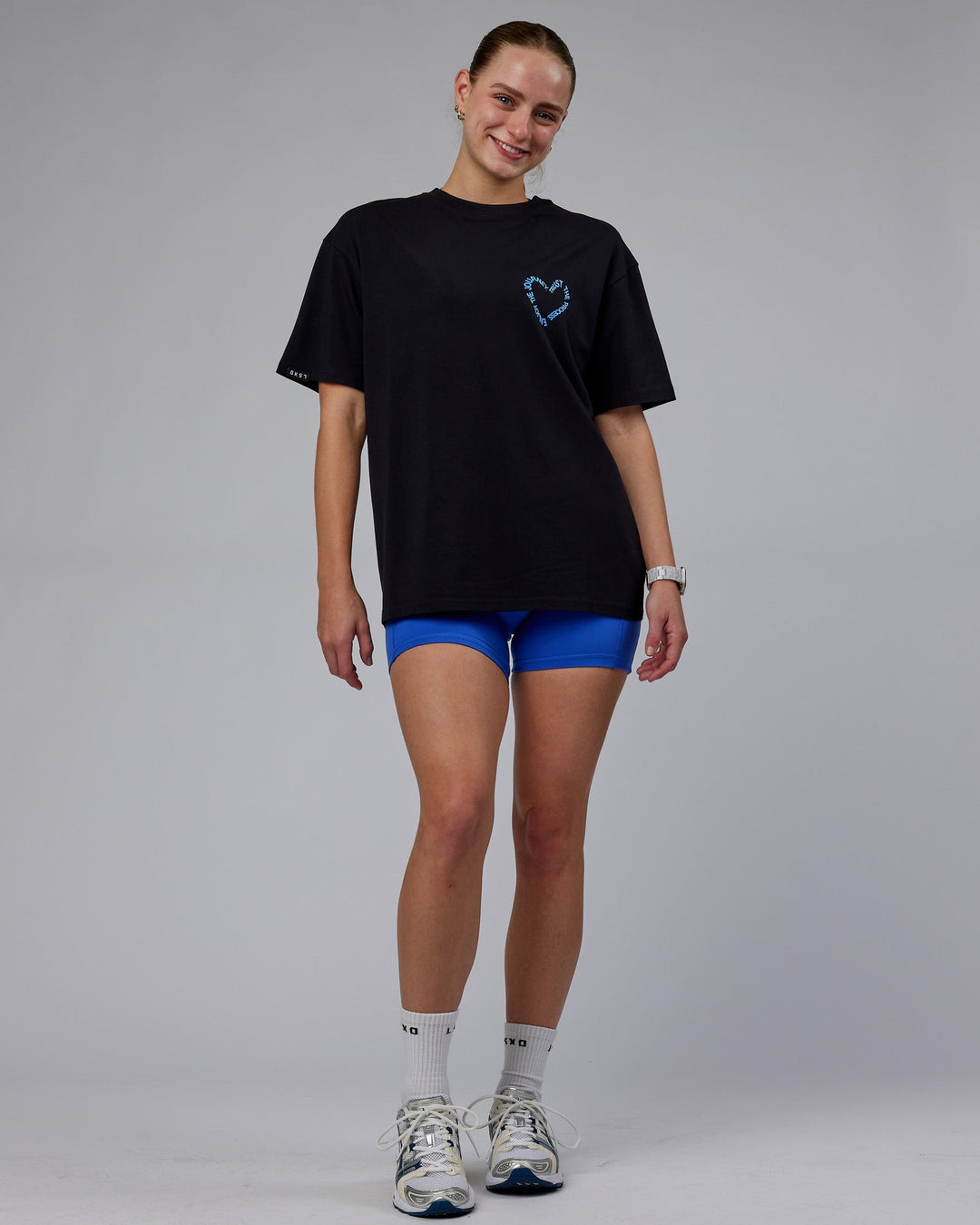 Woman wearing Unisex Love The Process FLXCotton Oversize Tee - Black-Power Cobalt