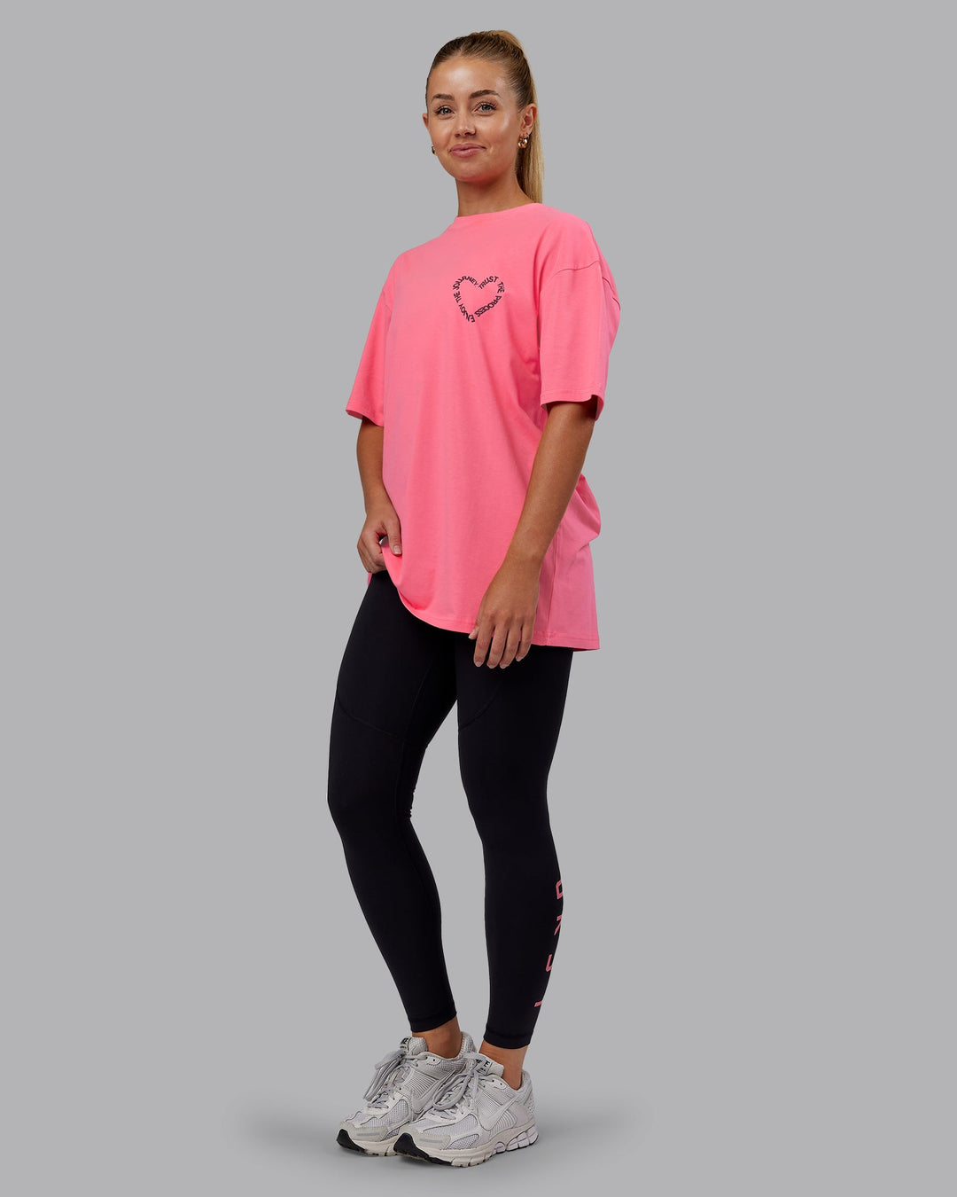 Man wearing Love The Process FLXCotton Oversize Tee - Pink Lemonade-Cherry Lacquer | Model:Hannah | Size:XS