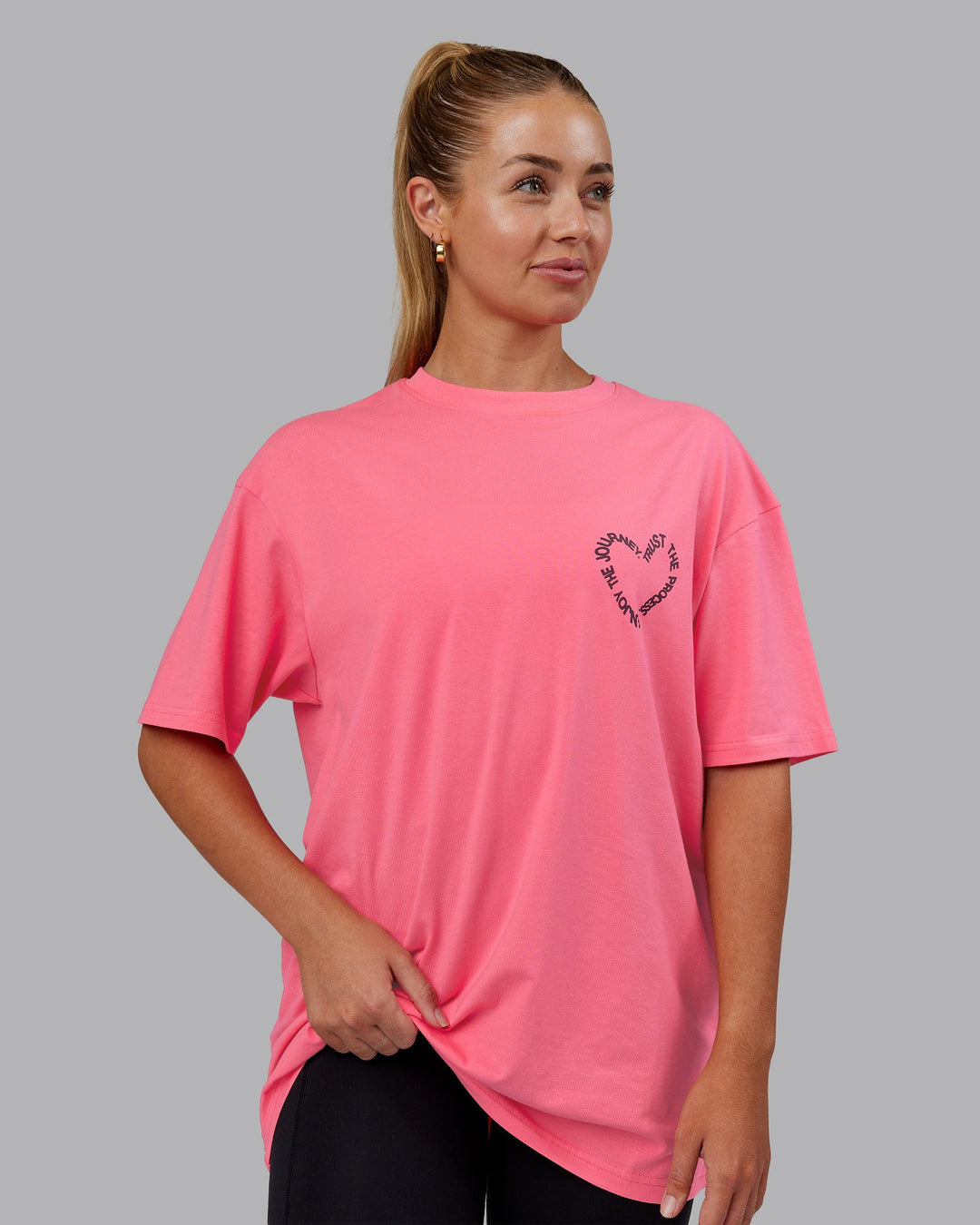 Man wearing Love The Process FLXCotton Oversize Tee - Pink Lemonade-Cherry Lacquer | Model:Hannah | Size:XS