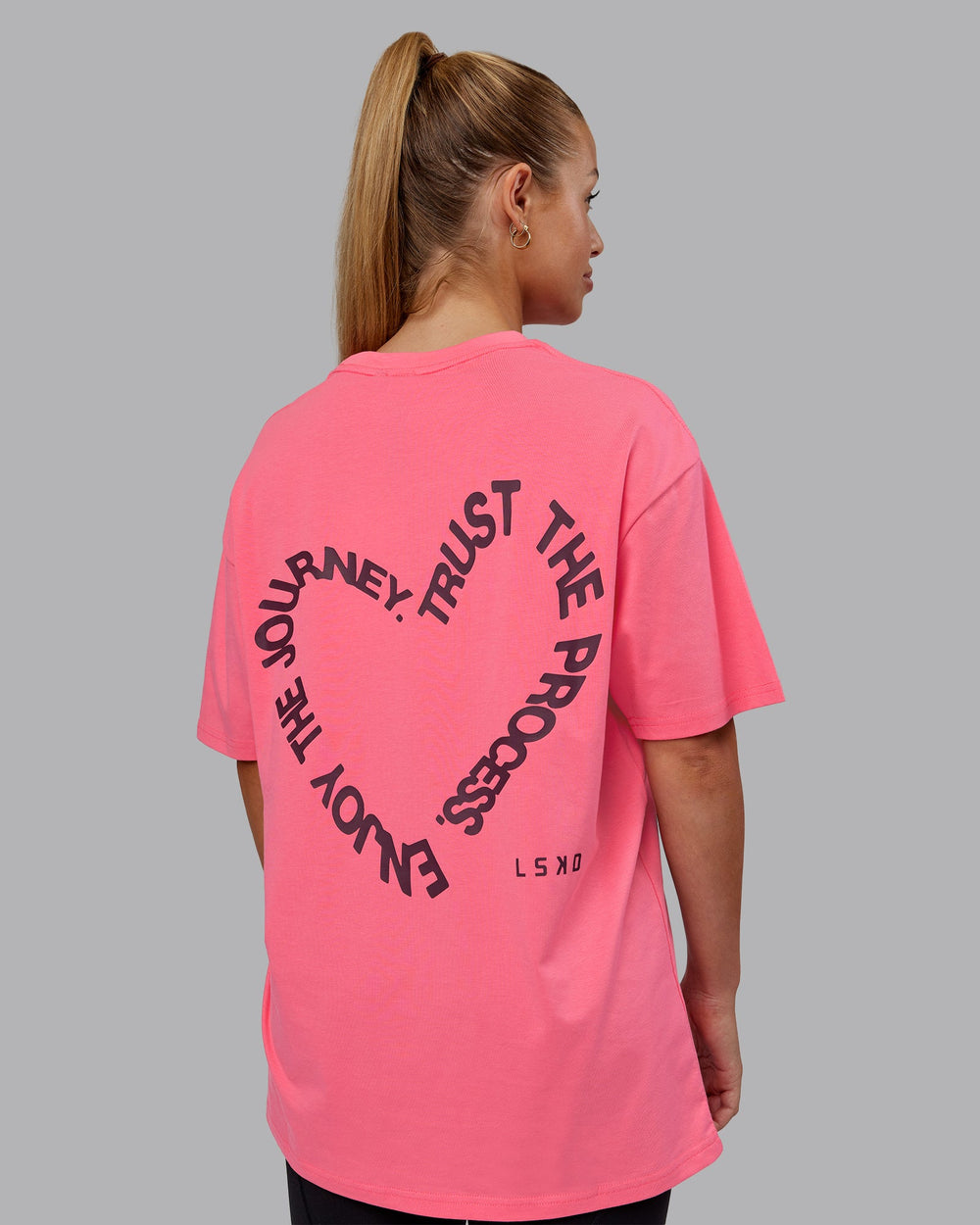 Man wearing Love The Process FLXCotton Oversize Tee - Pink Lemonade-Cherry Lacquer | Model:Hannah | Size:XS