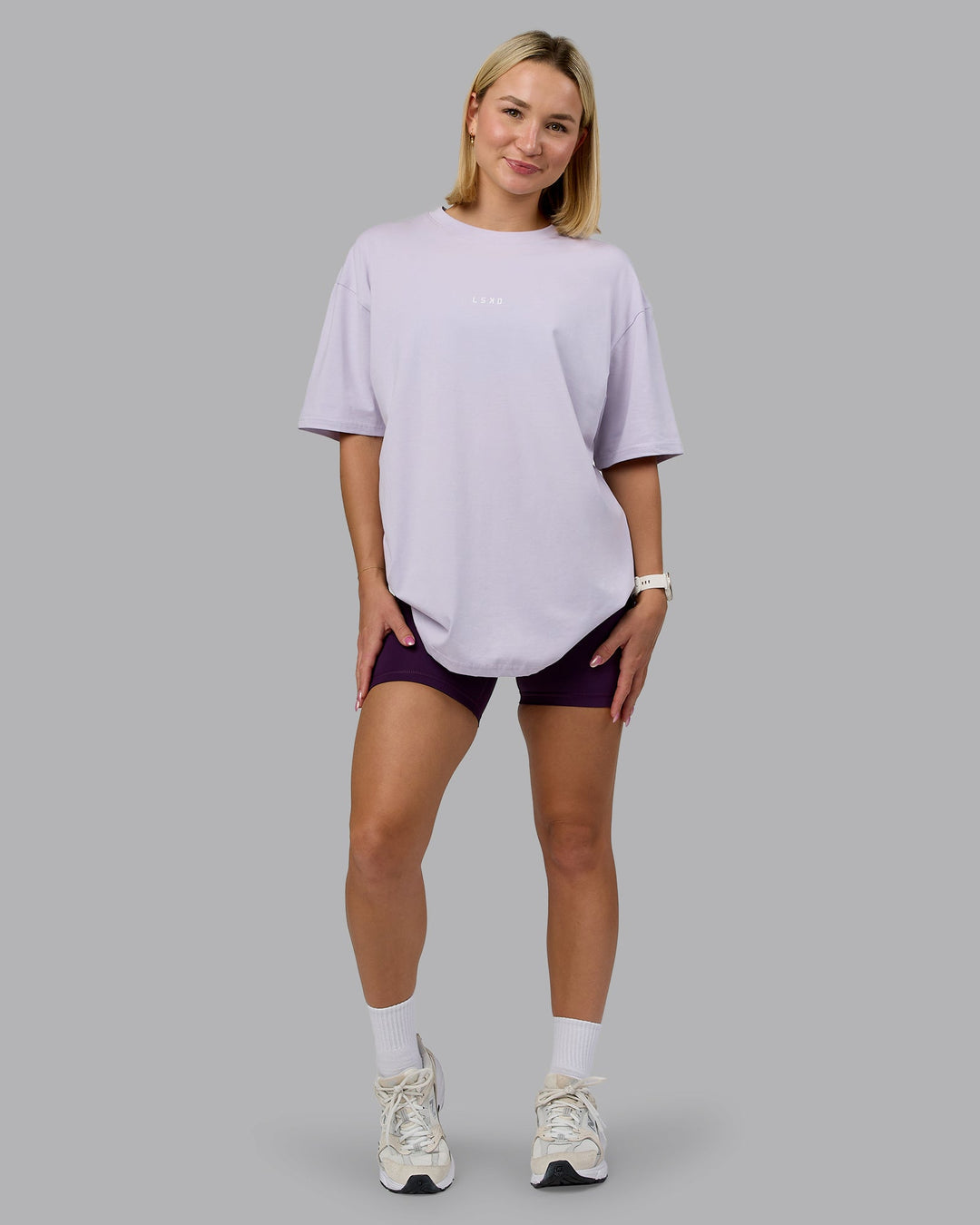 Woman wearing On Repeat FLXCotton Oversized Tee - Galactic Lilac-Peach Fuzz | Model:Halle | Size:XS