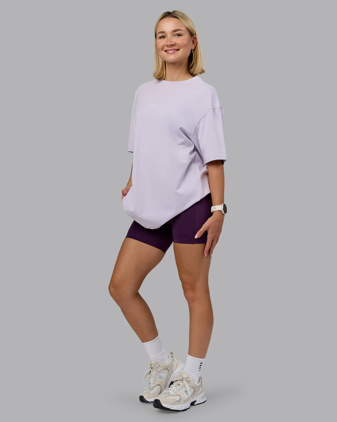 Woman wearing On Repeat FLXCotton Oversized Tee - Galactic Lilac-Peach Fuzz | Model:Halle | Size:XS