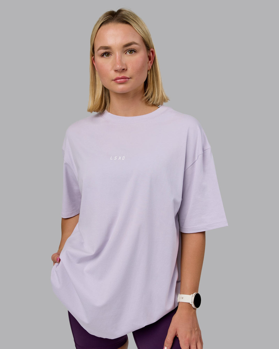 Woman wearing On Repeat FLXCotton Oversized Tee - Galactic Lilac-Peach Fuzz | Model:Halle | Size:XS