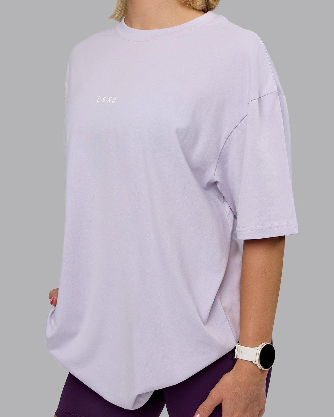 Woman wearing On Repeat FLXCotton Oversized Tee - Galactic Lilac-Peach Fuzz | Model:Halle | Size:XS