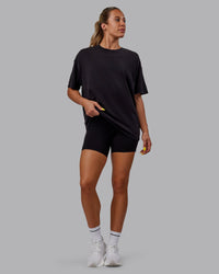 Woman wearing Unisex Washed Pressure Heavyweight Tee Oversize - Black-White