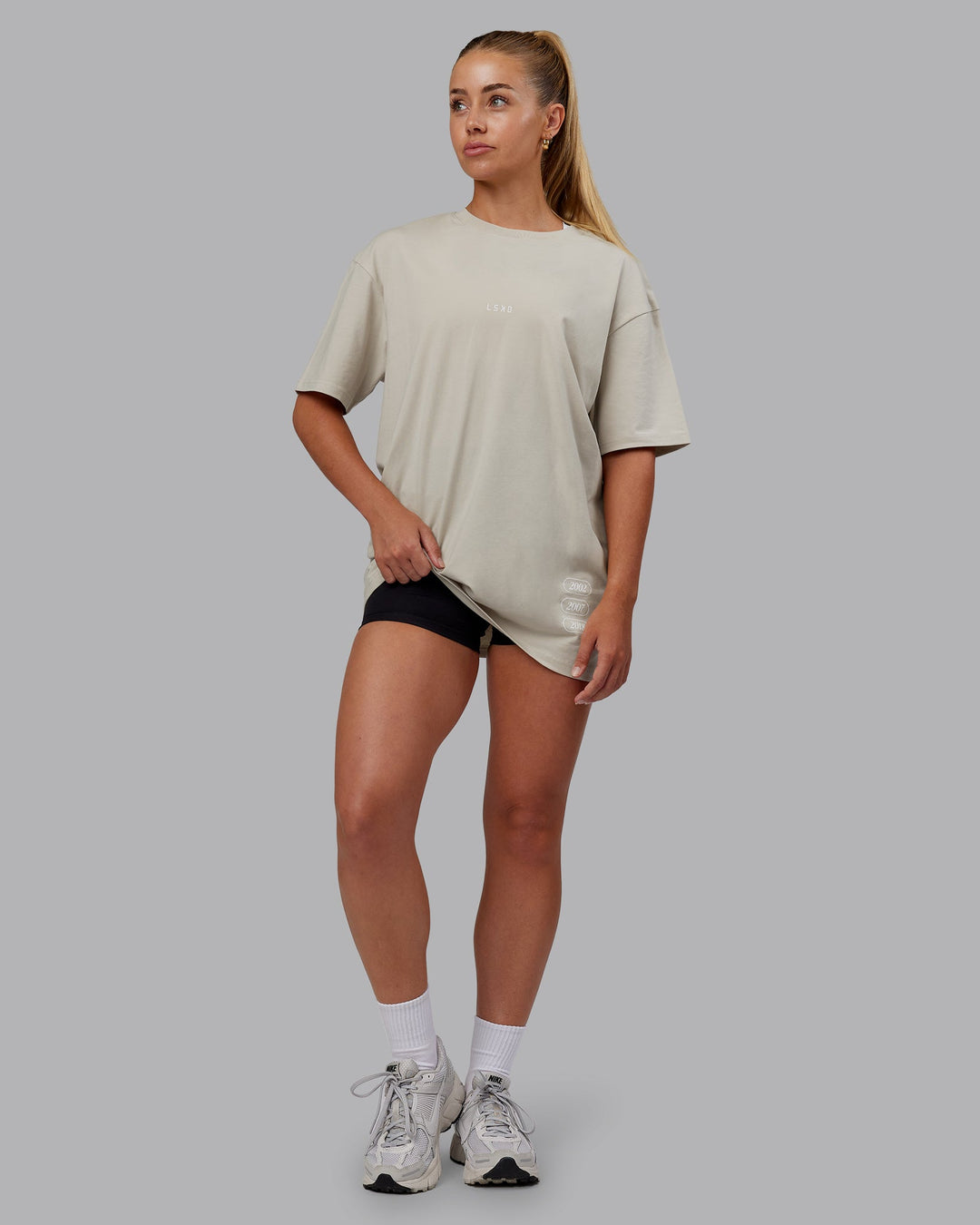 Woman wearing Timeline FLXCotton Oversized Tee - Shale Beige-White | Model:Hannah | Size:XS