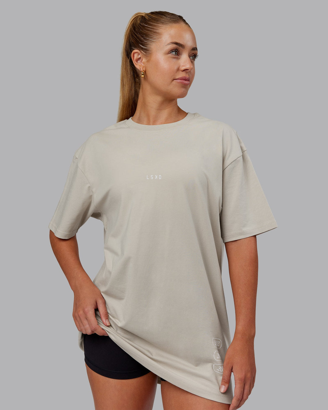 Woman wearing Timeline FLXCotton Oversized Tee - Shale Beige-White | Model:Hannah | Size:XS