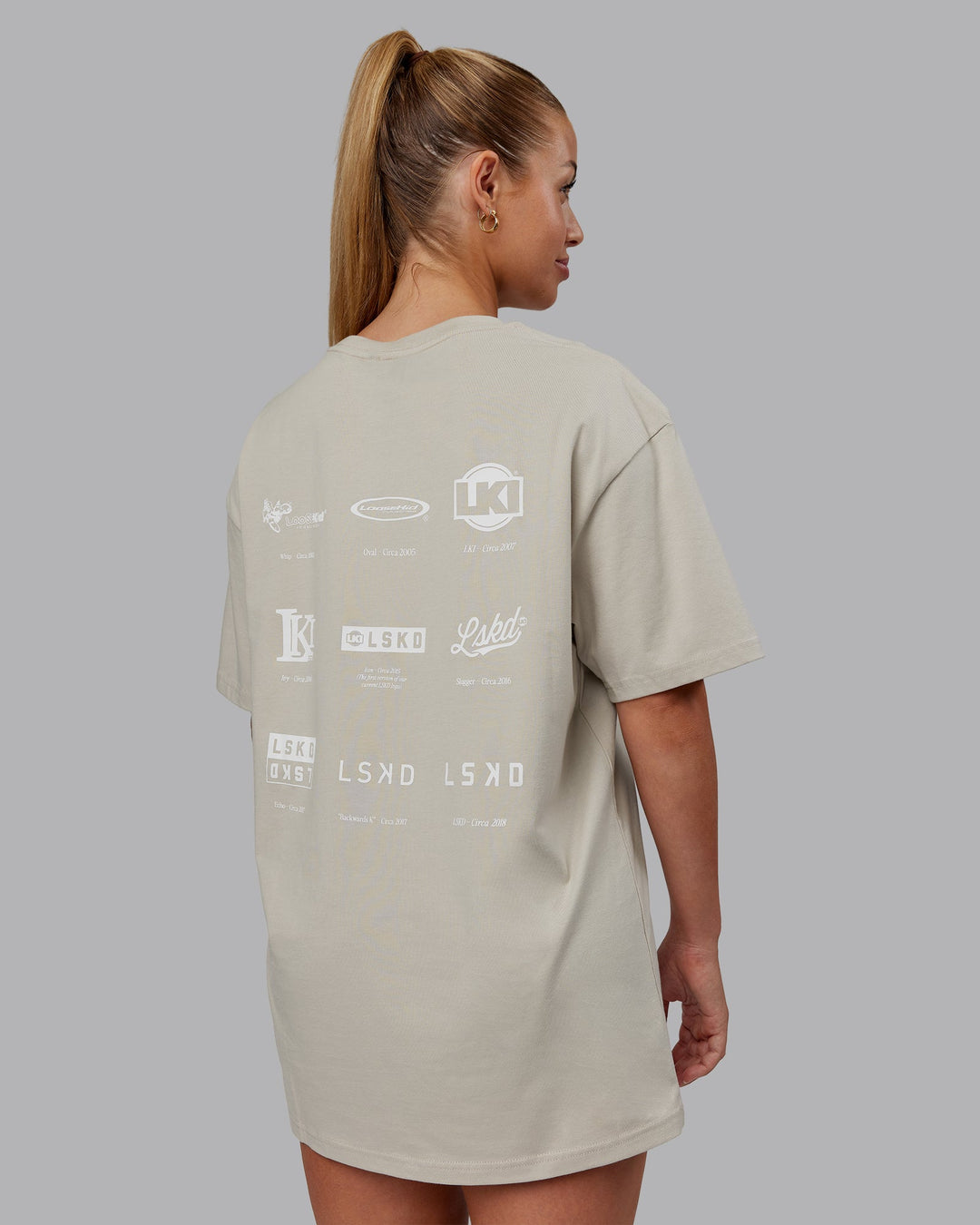 Woman wearing Timeline FLXCotton Oversized Tee - Shale Beige-White | Model:Hannah | Size:XS