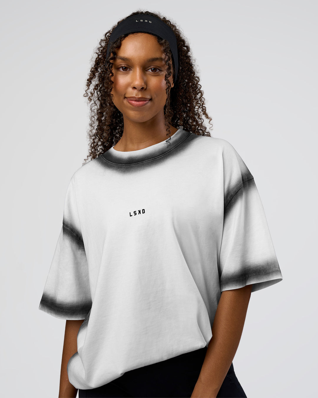 Woman wearing Urban Blur Heavyweight Unisex Oversized Tee - White-Black | Model:Jordan | Size:S