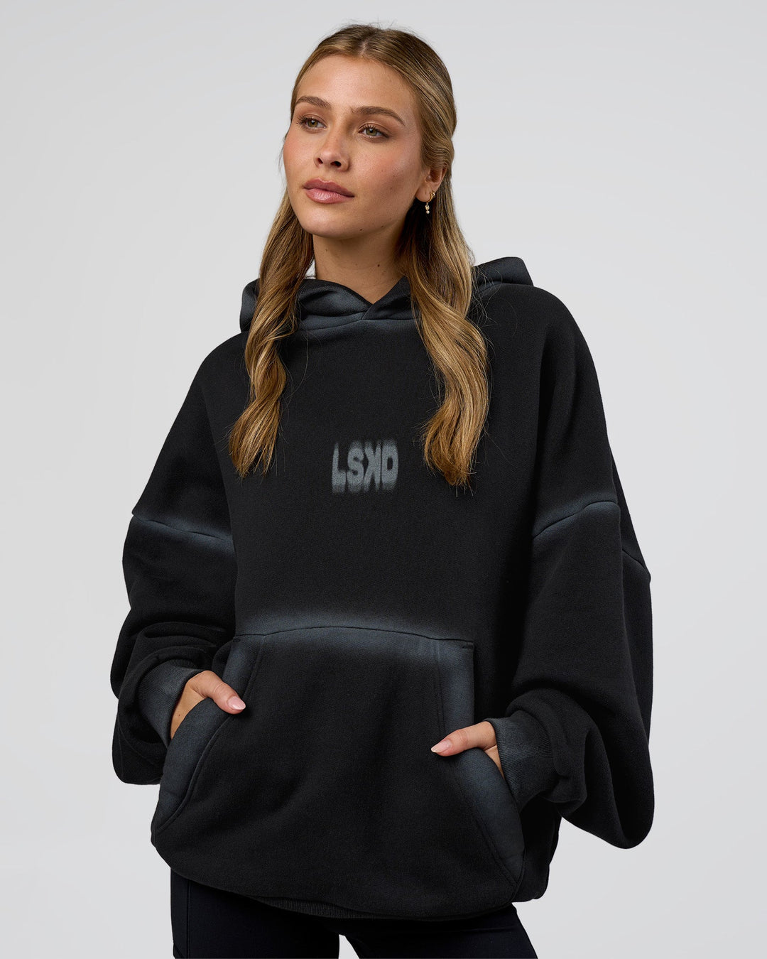 Woman wearing Urban Blur Unisex Oversized Hoodie - Black-Dark Storm | Model:Leilani | Size:XS