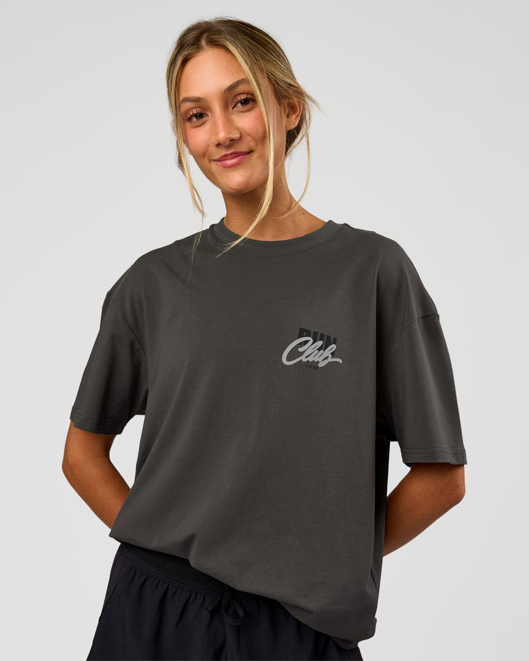 Woman wearing Values Run Club FLXCotton Tee - Dark Storm-Alloy | Model:Georgia | Size:XS