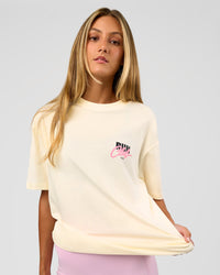 Woman wearing Values Run Club FLXCotton Tee - Off White-Candy Pink | Model:Georgia | Size:XS