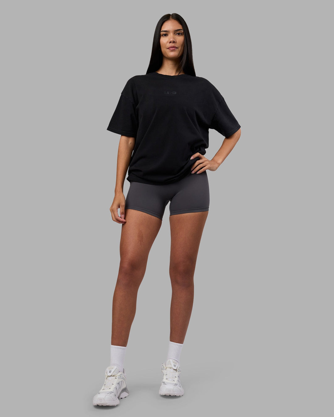 Woman wearing Variation Heavyweight FLXCotton Oversized Tee - Black-Black | Model:Rhiley | Size:XS