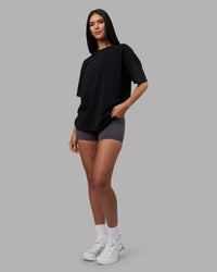 Woman wearing Variation Heavyweight FLXCotton Oversized Tee - Black-Black | Model:Rhiley | Size:XS