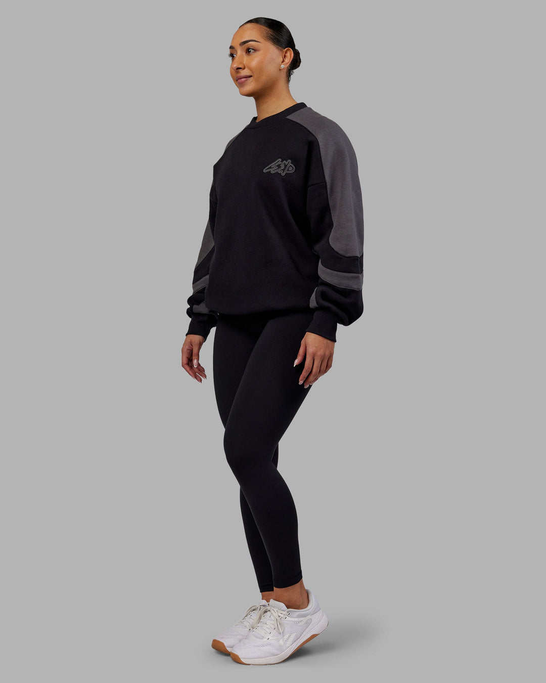 Woman wearing Vibe Oversized Unisex Sweater - Black-Dark Storm | Model:Ayla  Size:XS