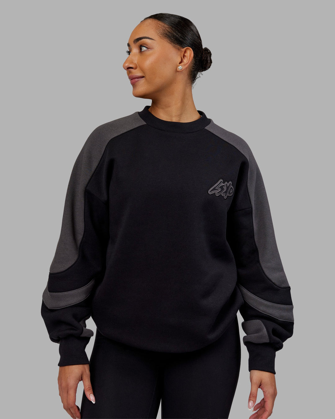 Woman wearing Vibe Oversized Unisex Sweater - Black-Dark Storm | Model:Ayla  Size:XS