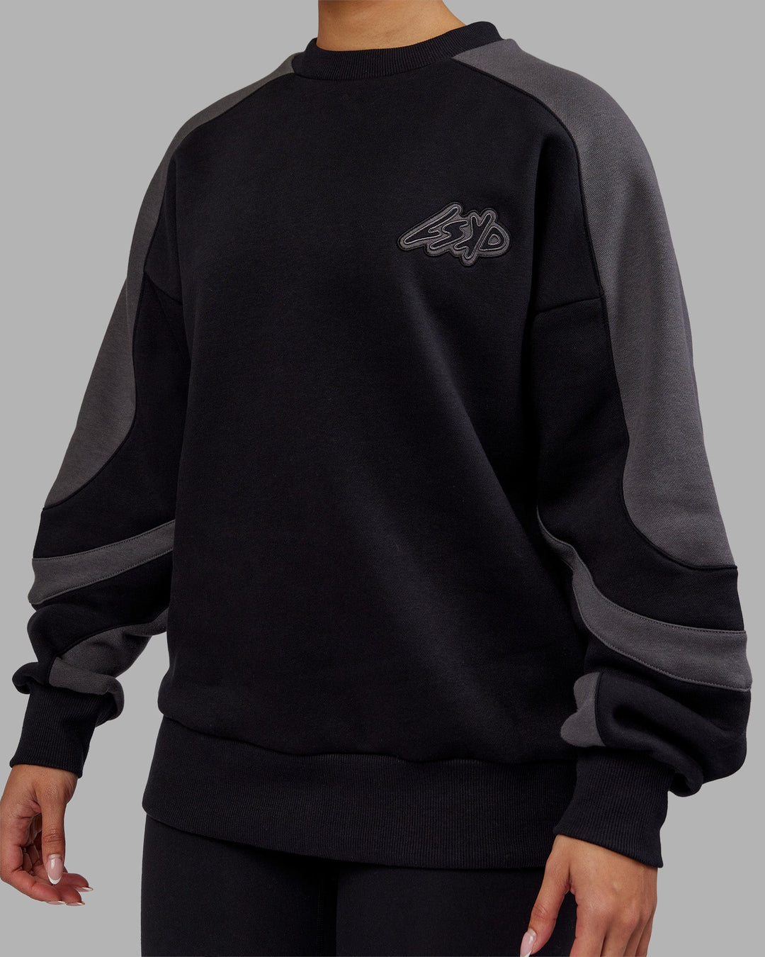 Woman wearing Vibe Oversized Unisex Sweater - Black-Dark Storm | Model:Ayla  Size:XS