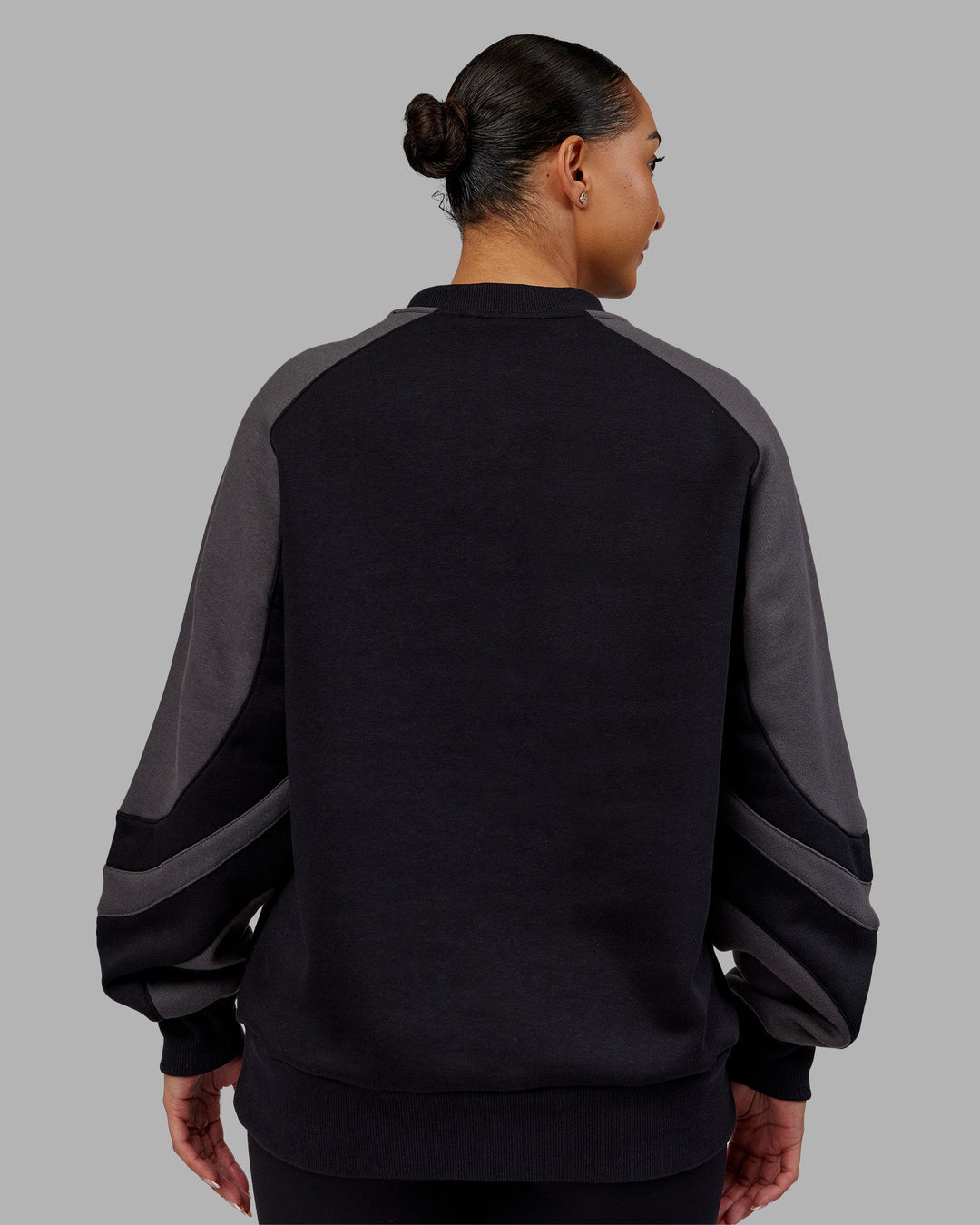 Woman wearing Vibe Oversized Unisex Sweater - Black-Dark Storm | Model:Ayla  Size:XS