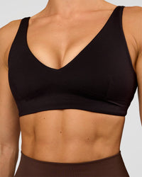 Woman wearing Vitality Sports Bra - Black | Model:Maja | Size:XS