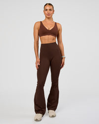 Woman wearing Vitality Sports Bra - Hot Chocolate | Model:Maja | Size:XS