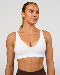 Woman wearing Vitality Sports Bra - White | Model:Maja | Size:XS