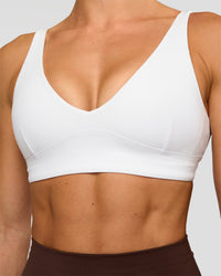 Woman wearing Vitality Sports Bra - White | Model:Maja | Size:XS