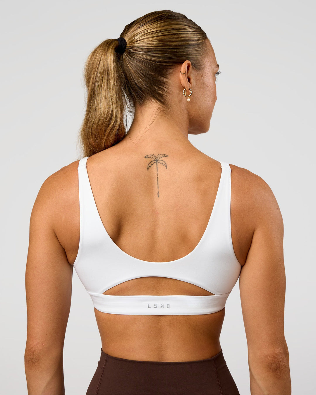 Woman wearing Vitality Sports Bra - White | Model:Maja | Size:XS