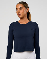 Woman wearing AeroFLX+ Seamless Long Sleeve Skimmer Tee - Future Navy/Future Navy | Model:Charli | Size:XS | Thumbnail Index: 1