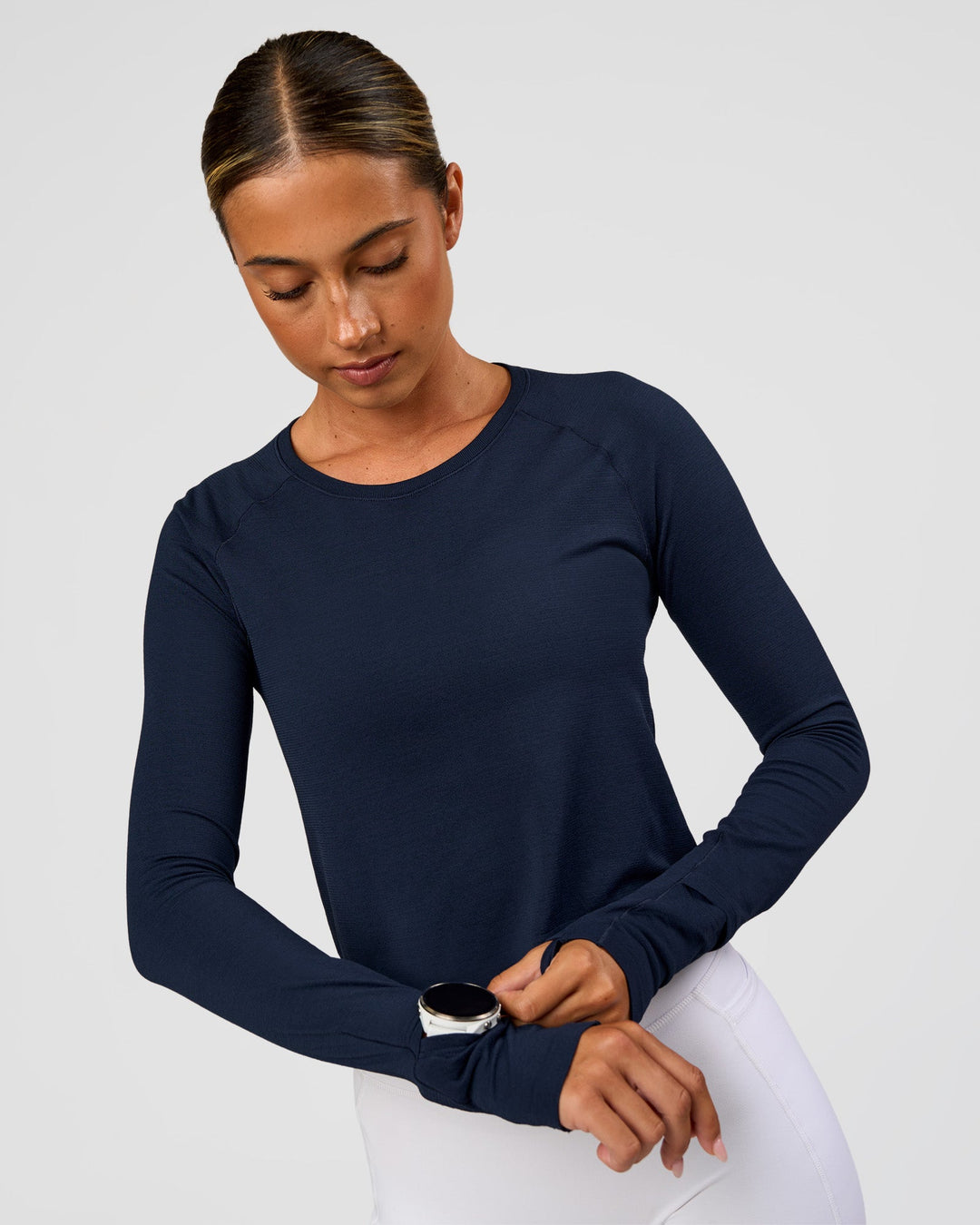 Woman wearing AeroFLX+ Seamless Long Sleeve Skimmer Tee - Future Navy/Future Navy | Model:Charli | Size:XS - view 7