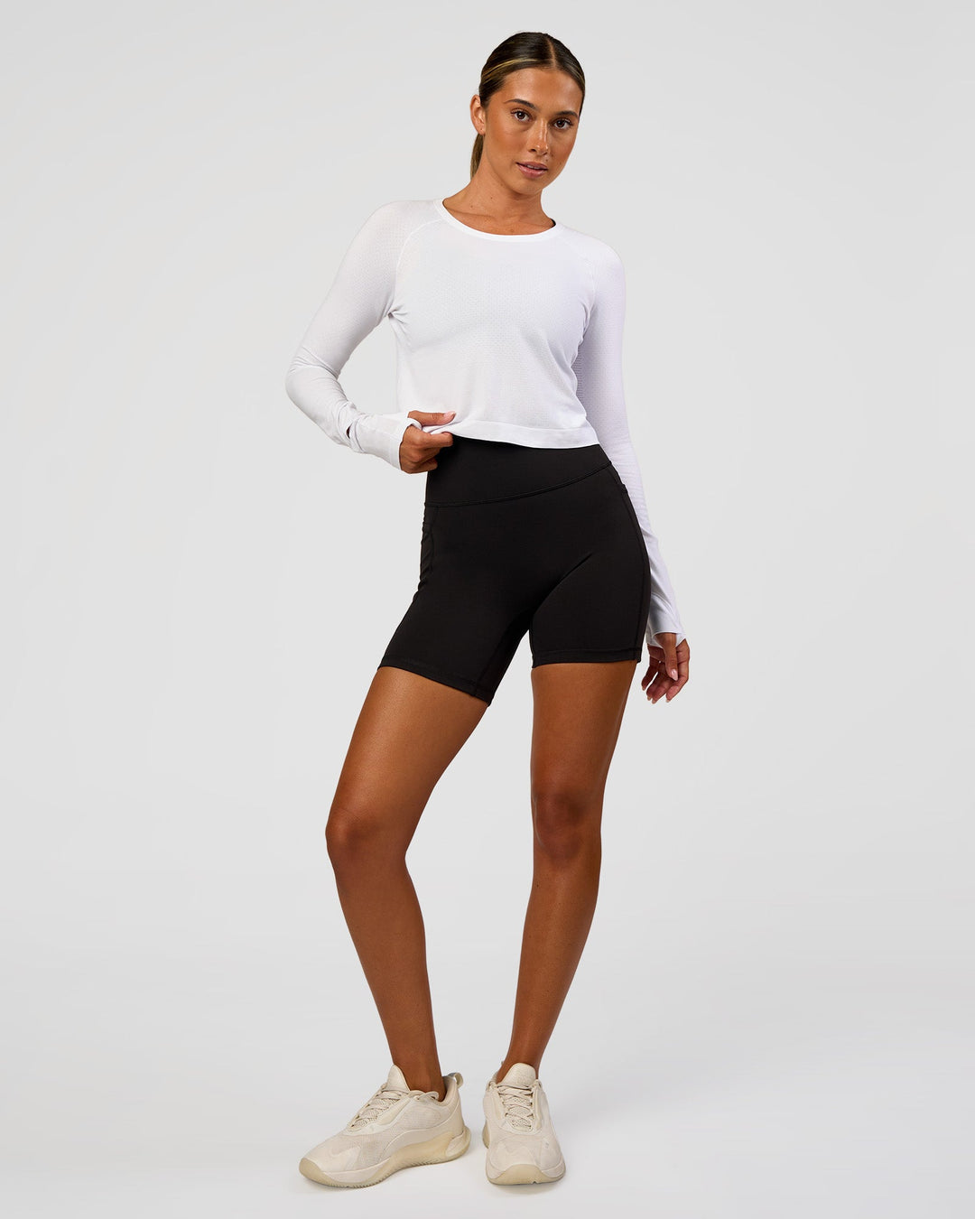 Woman wearing AeroFLX+ Seamless Long Sleeve Skimmer Tee - White/White | Model:Charli | Size:XS - view 6