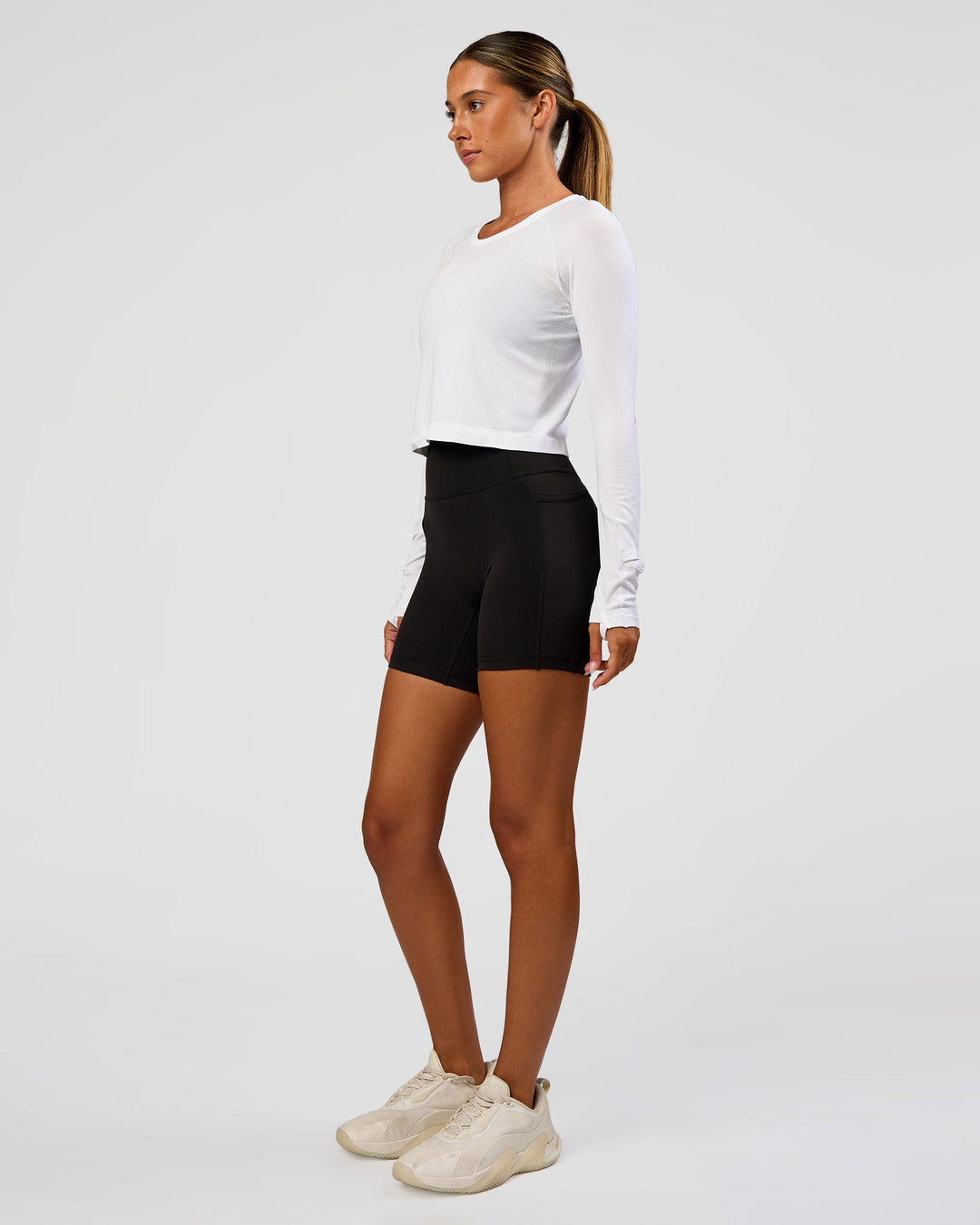 Woman wearing AeroFLX+ Seamless Long Sleeve Skimmer Tee - White/White | Model:Charli | Size:XS - view 8