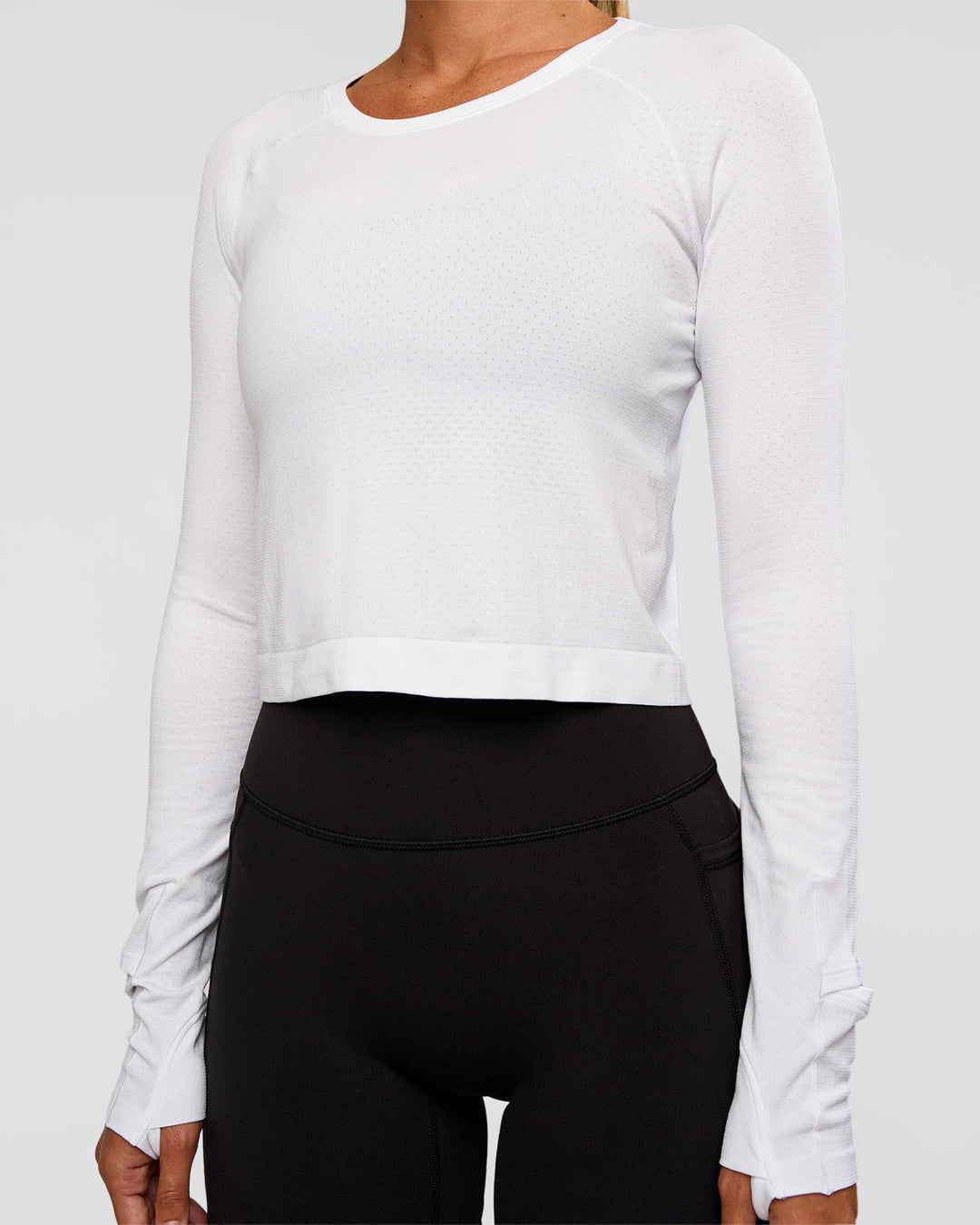 Woman wearing AeroFLX+ Seamless Long Sleeve Skimmer Tee - White/White | Model:Charli | Size:XS - view 9