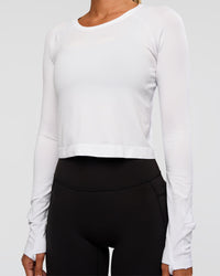 Woman wearing AeroFLX+ Seamless Long Sleeve Skimmer Tee - White/White | Model:Charli | Size:XS | Thumbnail Index: 8