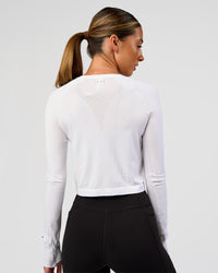 Woman wearing AeroFLX+ Seamless Long Sleeve Skimmer Tee - White/White | Model:Charli | Size:XS | Thumbnail Index: 6