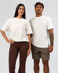 Duo wearing Built On Values FLXCotton Oversized Tee - Off White-Pink Rose | Model:Xav | Size:L | Model:Rhiley | Size:XS
