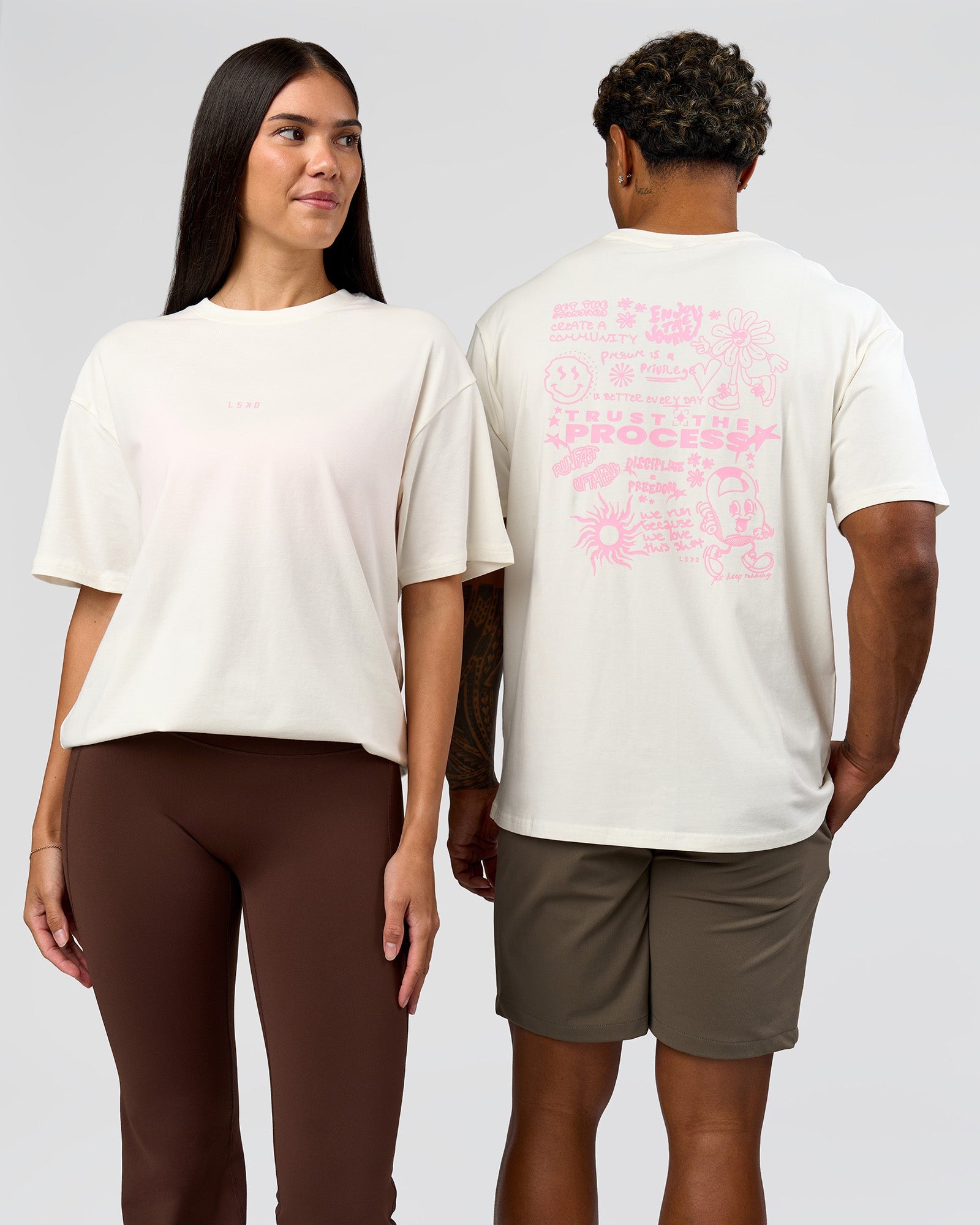 Duo wearing Built On Values FLXCotton Oversized Tee - Off White-Pink Rose | Model:Xav | Size:L | Model:Rhiley | Size:XS