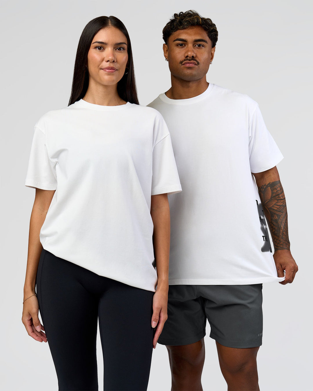 Duo wearing Clear Vision Heavyweight FLXCotton Oversized Tee - White-Black | Model:Xav | Size:L | Model:Rhiley | Size:XS - view 1