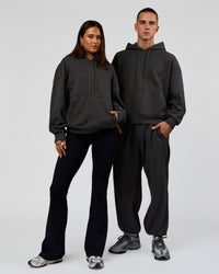 Duo wearing Base Oversized DC Hoodie - Onyx | Model:Albert | Size:M | Model:Bianca | Size:XS | Thumbnail Index: 1