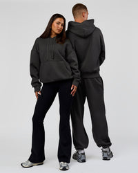 Duo wearing Base Oversized DC Hoodie - Onyx | Model:Albert | Size:M | Model:Bianca | Size:XS | Thumbnail Index: 2