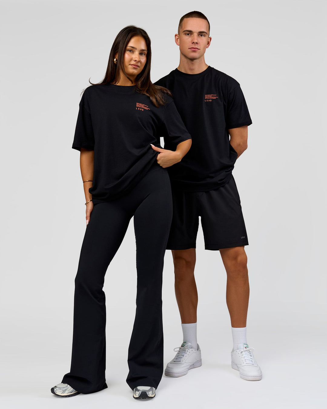 Duo wearing Coffee Run FLXCotton Oversized Tee - Black-Ultra Orange | Model:Albert | Size:M | Model:Bianca | Size:XS - view 8