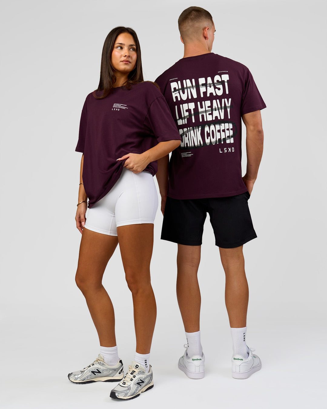 Duo wearing Coffee Run FLXCotton Oversized Tee - Cherry Lacquer-Black | Model:Albert | Size:M | Model:Bianca | Size:XS - view 2