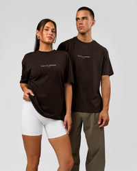 Duo wearing VS1 Enjoy The Journey FLXCotton Oversize Tee - Ground Coffee | Model:Albert | Size:M | Model:Bianca | Size:XS | Thumbnail Index: 2